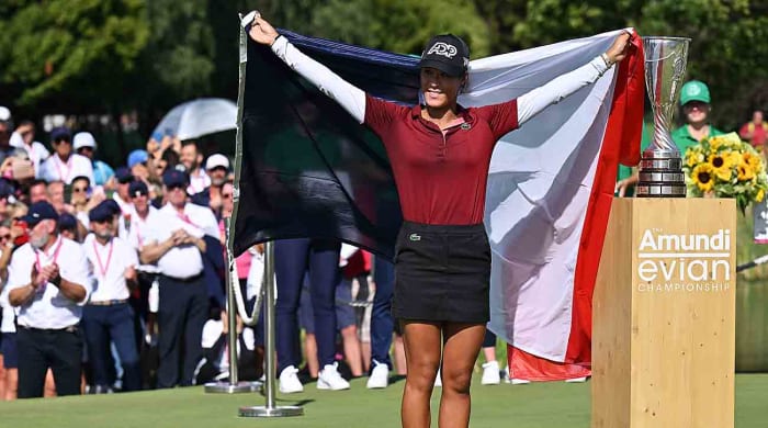 Céline Boutier of France celebrates alongside the Amundi Evian Championship trophy following victory in the 2023 Amundi Evian Championship at Evian-les-Bains, France
